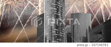 Celebratory fireworks over the Skyscrapers La Defense, commercial and business center of Paris, France 107148761