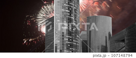 Celebratory fireworks over the Skyscrapers La Defense, commercial and business center of Paris, France Celebratory fireworks over the Skyscrapers La Defense, commercial and business center of Paris, France 107148794