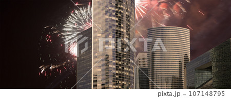 Celebratory fireworks over the Skyscrapers La Defense, commercial and business center of Paris, France Celebratory fireworks over the Skyscrapers La Defense, commercial and business center of Paris, France 107148795
