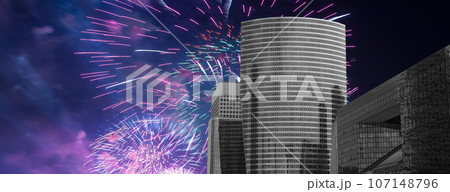 Celebratory fireworks over the Skyscrapers La Defense, commercial and business center of Paris, France Celebratory fireworks over the Skyscrapers La Defense, commercial and business center of Paris, France 107148796