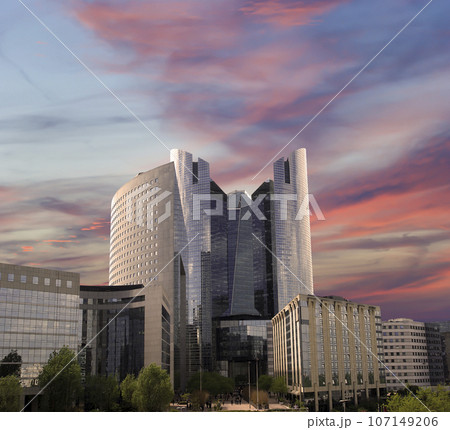 Skyscrapers La Defense (against the background of a sky at sunset), commercial and business center of Paris, France 107149206