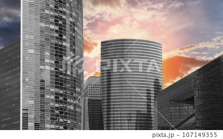 Skyscrapers La Defense (against the background of a sky at sunset), commercial and business center of Paris, France 107149355