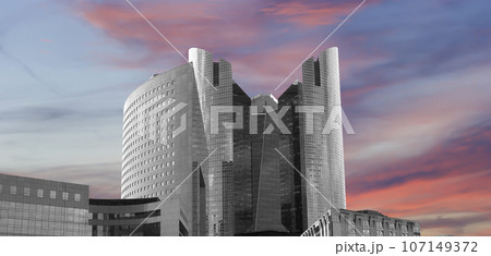 Skyscrapers La Defense (against the background of a sky at sunset), commercial and business center of Paris, France 107149372
