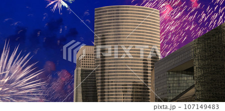 Celebratory fireworks over the Skyscrapers La Defense, commercial and business center of Paris, France 107149483