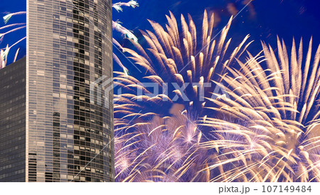 Celebratory fireworks over the Skyscrapers La Defense, commercial and business center of Paris, France 107149484