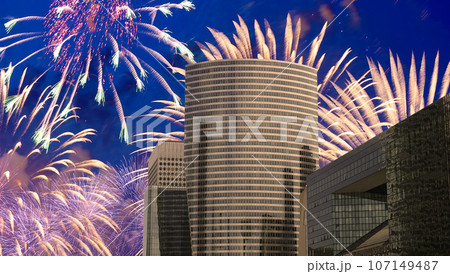 Celebratory fireworks over the Skyscrapers La Defense, commercial and business center of Paris, France 107149487