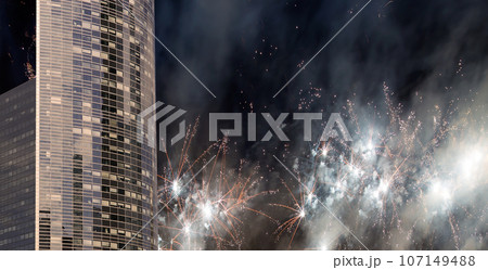 Celebratory fireworks over the Skyscrapers La Defense, commercial and business center of Paris, France Celebratory fireworks over the Skyscrapers La Defense, commercial and business center of Paris, France 107149488