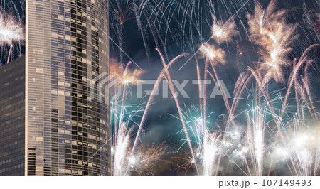 Celebratory fireworks over the Skyscrapers La Defense, commercial and business center of Paris, France 107149493
