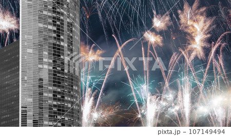 Celebratory fireworks over the Skyscrapers La Defense, commercial and business center of Paris, France 107149494