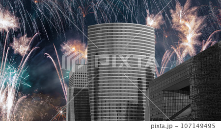 Celebratory fireworks over the Skyscrapers La Defense, commercial and business center of Paris, France 107149495