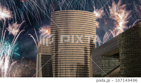 Celebratory fireworks over the Skyscrapers La Defense, commercial and business center of Paris, France 107149496