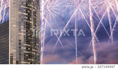 Celebratory fireworks over the Skyscrapers La Defense, commercial and business center of Paris, France 107149497