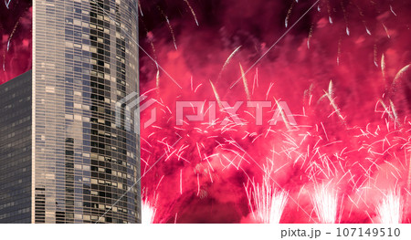 Celebratory fireworks over the Skyscrapers La Defense, commercial and business center of Paris, France 107149510