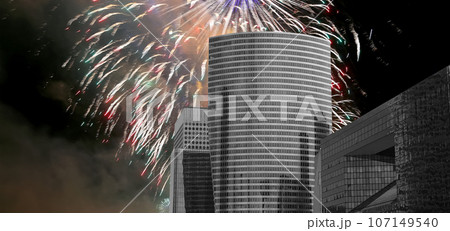 Celebratory fireworks over the Skyscrapers La Defense, commercial and business center of Paris, France 107149540