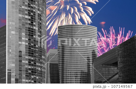 Celebratory fireworks over the Skyscrapers La Defense, commercial and business center of Paris, France 107149567