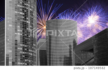 Celebratory fireworks over the Skyscrapers La Defense, commercial and business center of Paris, France 107149582