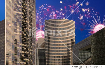 Celebratory fireworks over the Skyscrapers La Defense, commercial and business center of Paris, France 107149583