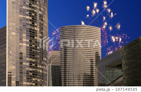 Celebratory fireworks over the Skyscrapers La Defense, commercial and business center of Paris, France 107149585
