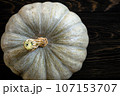 Pumpkin on dark wood background for Halloween theme, top view 107153707