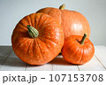 Pumpkins on white wooden table for Halloween theme 107153708