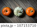 Pumpkins on wood planks background for Halloween theme 107153710