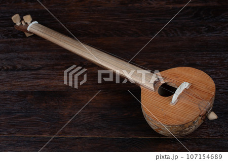 Turkish tambur. Long-necked folk string instrument of the lute family. Turkish tambur. Long-necked folk string instrument of the lute family. 107154689