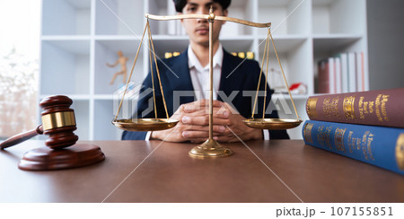 Portrait of a judge hold judges gavel and old scales concept of justice lawyer concept Judge Portrait of a judge hold judges gavel and old scales concept of justice lawyer concept Judge 107155851