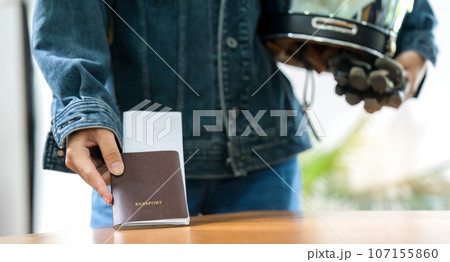 Young asian woman traveler prepare for the summer vacation, Travel concept, Holding a passport Young asian woman traveler prepare for the summer vacation, Travel concept, Holding a passport 107155860