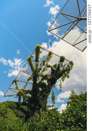Botanical garden on the roof of the Warsaw University library modern architecture and greenery. Sustainable building architecture futuristic biophilia design. Ecological green modern building. Modern Botanical garden on the roof of the Warsaw University library modern architecture and greenery. Sustainable building architecture futuristic biophilia design. Ecological green modern building. Modern 107156817