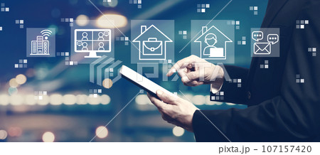 Telework theme with businessman using a tablet Telework theme with businessman using a tablet 107157420