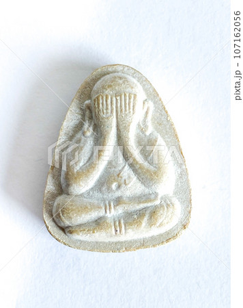 Thai old buddha amulet on white background Thai old buddha amulet on white background 107162056