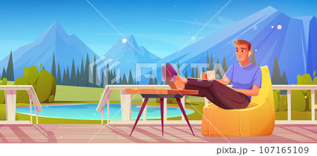 Man sitting on porch with mountain view background 107165109