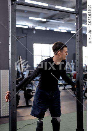 young awesome man having fun at gym 107165610
