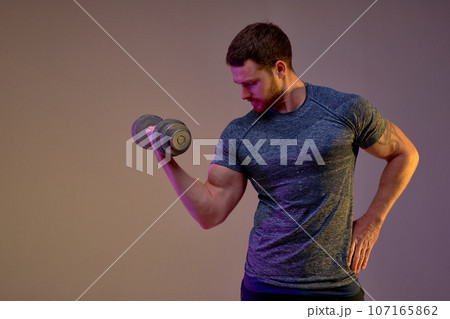 skilled bodybuilder bending his arm skilled bodybuilder bending his arm 107165862
