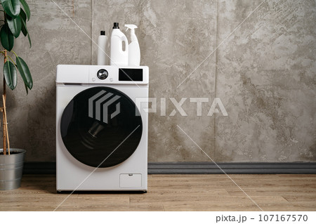 Washing machine in a gray modern laundry room Washing machine in a gray modern laundry room 107167570