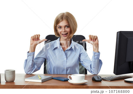 successful business woman looking at camera and using PC computer successful business woman looking at camera and using PC computer 107168800