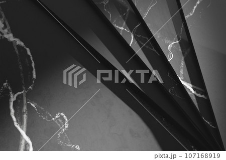 Simple black and white marble background with light streaming in. 107168919