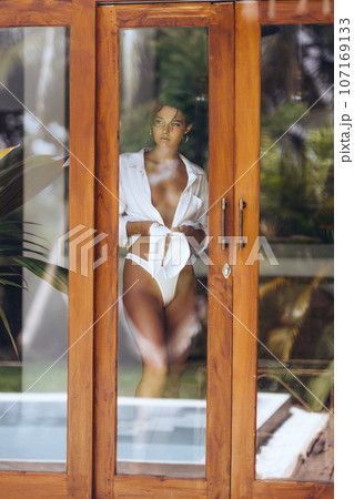 Spying of Young Sexy Woman in Lingerie Through... - Stock Photo [107169133] 