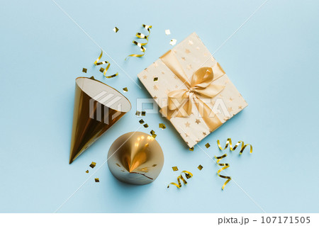 Holiday background with colorful balloon, gift and confetti. Flat lay style. Birthday or party greeting card with copy space 107171505