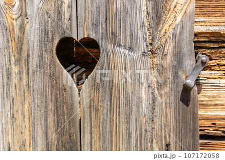heart and old brown rustic dark grunge wooden texture - wood Background banner. heart and old brown rustic dark grunge wooden texture - wood Background banner. 107172058