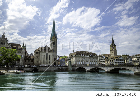 Scenic view of historic Zurich city center with famous Fraumunster and river Limmat at Lake Zurich,Switzerland 107173420