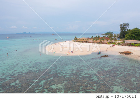Aerial view of clear blue turquoise seawater, Andaman sea in Phuket island in summer season, Thailand. Water in ocean pattern texture wallpaper background. Aerial view of clear blue turquoise seawater, Andaman sea in Phuket island in summer season, Thailand. Water in ocean pattern texture wallpaper background. 107175011