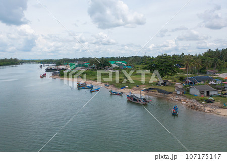 Aerial view of clear blue turquoise seawater, Andaman sea in Phuket island in summer season, Thailand. Water in ocean pattern texture wallpaper background. Aerial view of clear blue turquoise seawater, Andaman sea in Phuket island in summer season, Thailand. Water in ocean pattern texture wallpaper background. 107175147
