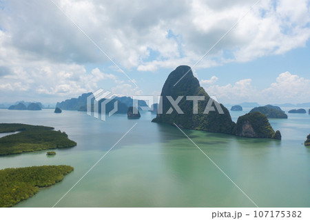 Aerial top view of Samet Nangshe, Phang Nga, lush green trees from above in tropical forest in national park in summer season. Natural landscape. Pattern texture background. Aerial top view of Samet Nangshe, Phang Nga, lush green trees from above in tropical forest in national park in summer season. Natural landscape. Pattern texture background. 107175382