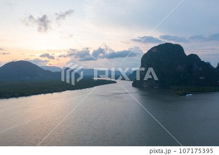 Aerial top view of a garden park with green mangrove forest trees, river, pond or lake. Nature landscape background, Thailand. 107175395