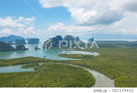 Aerial top view of Samet Nangshe, Phang Nga, lush green trees from above in tropical forest in national park in summer season. Natural landscape. Pattern texture background. 107175412