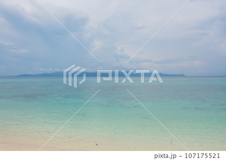 Aerial view of clear blue turquoise seawater, Andaman sea in Phuket island in summer season, Thailand. Water in ocean pattern texture wallpaper background. 107175521