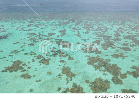 Aerial view of clear blue turquoise seawater, Andaman sea in Phuket island in summer season, Thailand. Water in ocean pattern texture wallpaper background. 107175540