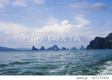 Floating yacht in Andaman sea and islands silhouettes, Thailand 107175828