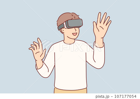 Boy wearing VR glasses enthusiastically uses new technology to immerse himself in virtual reality Boy wearing VR glasses enthusiastically uses new technology to immerse himself in virtual reality 107177054